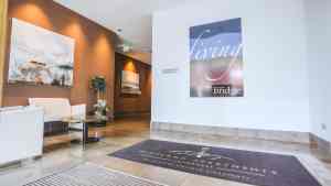 by the bridge apartment lobby